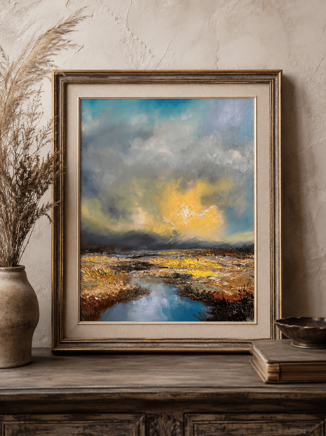 Original 30 × 40 cm palette knife oil landscape painting featuring dramatic storm clouds breaking to reveal golden sunlight over the French countryside. Thick impasto textures, a reflective stream, and expressive brushwork create a contemporary impressionist landscape full of atmosphere, movement, and light.
